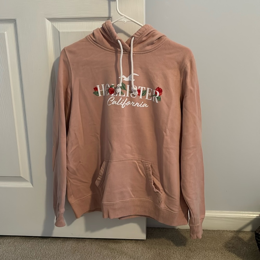 Pink Hollister sweatshirt.